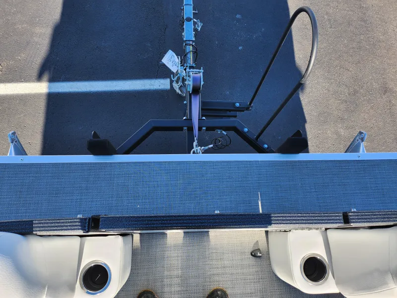 Slide: The Image of 2022 Crest Classic LX 200 boat trailer hitch, top view, on asphalt surface. - 25