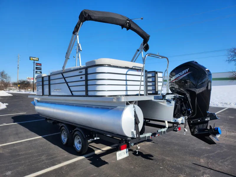 Slide: The Image of 2022 Crest Classic LX 200 pontoon boat on trailer, featuring Mercury outboard motor. - 3