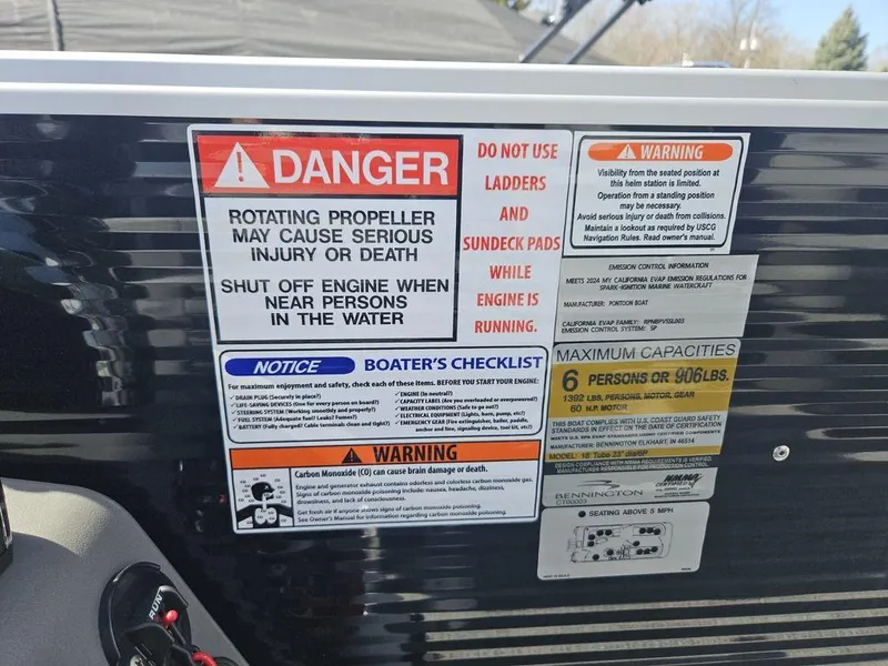 Slide: The Image of Warning labels on a 2025 Bennington 188 SL boat, highlighting safety precautions and capacity limits. - 10