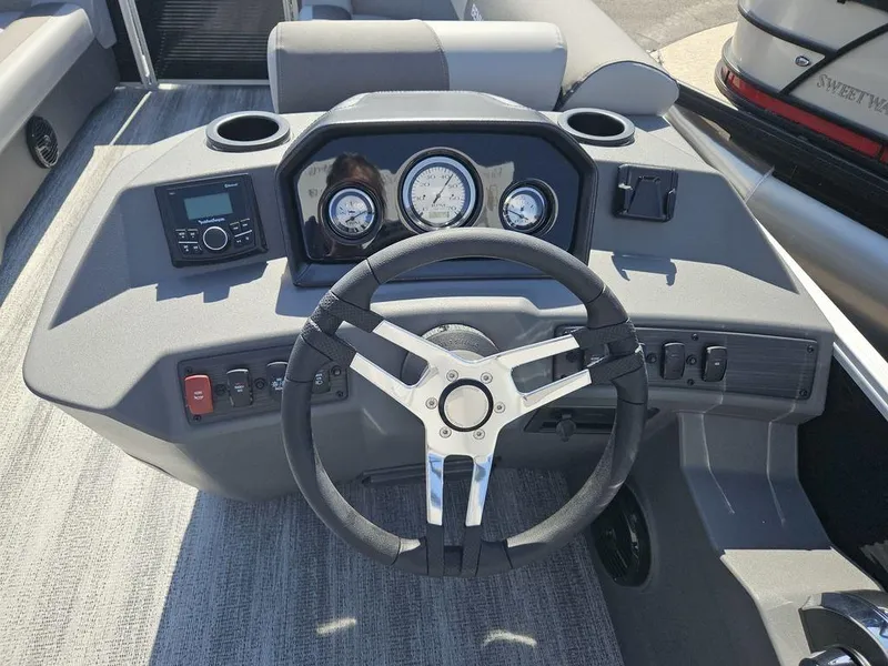Slide: The Image of Steering console of 2025 Bennington 188 SL boat with gauges and controls. - 2