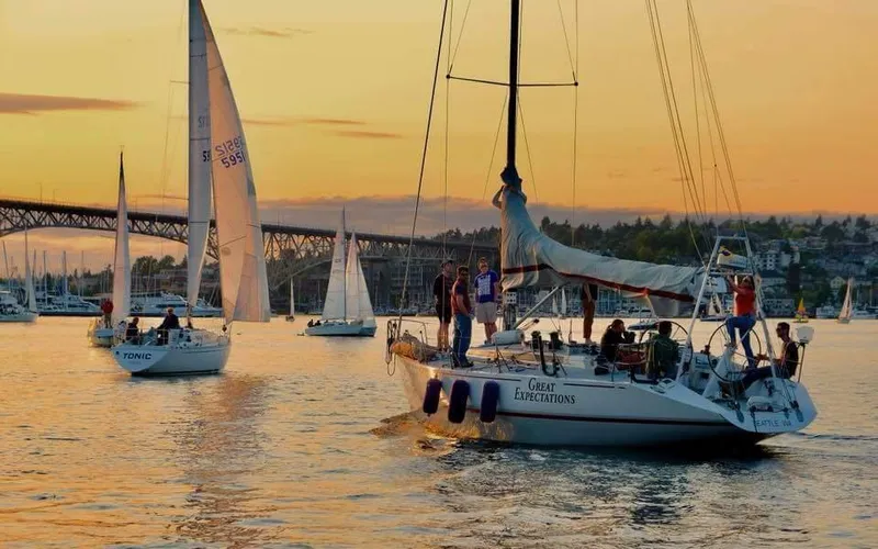 Slide: The Image of Sailboats on a serene sunset lake, featuring a 1985 Farr 50 model. - 41