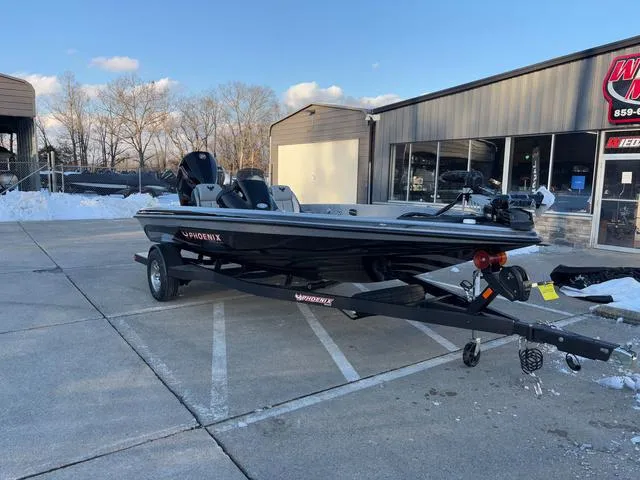 Slide: The Image of 2025 Phoenix 818 Pro boat on trailer in dealership parking lot. - 10