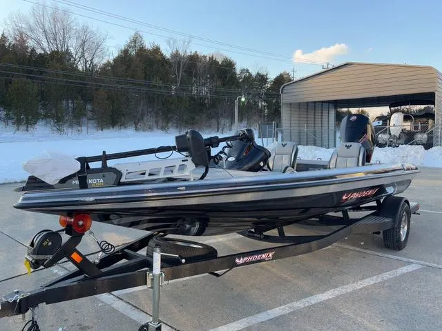 Slide: The Image of 2025 Phoenix 818 Pro boat on trailer in snowy outdoor setting. - 12