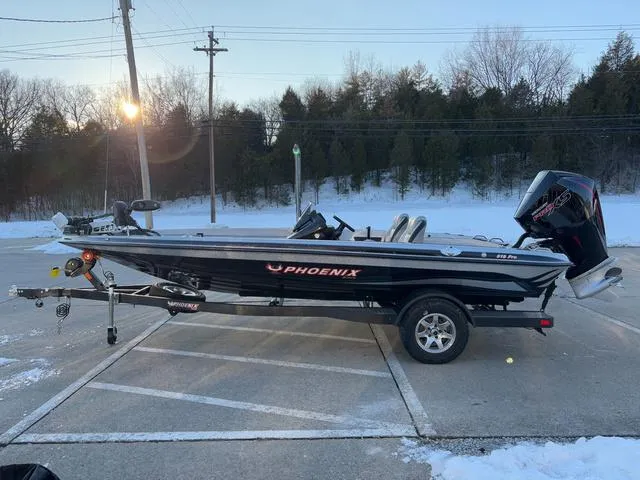 Slide: The Image of 2025 Phoenix 818 Pro boat on trailer in snowy parking lot. - 16