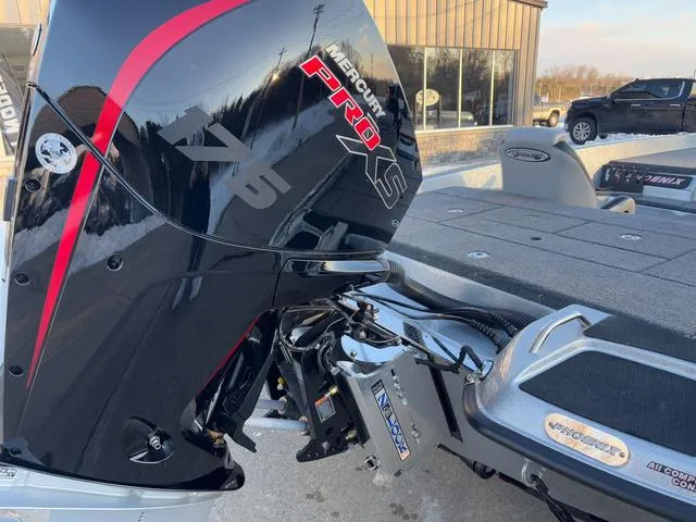 Slide: The Image of 2025 Phoenix 818 Pro boat with Mercury Pro XS engine, parked outdoors. - 3