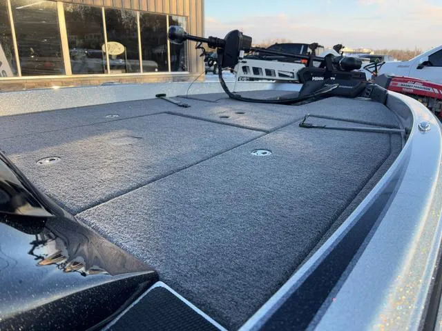 Slide: The Image of 2025 Phoenix 818 Pro boat deck with mounted equipment, in a showroom setting. - 8