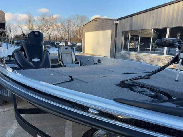 Slide: The Image of 2025 Phoenix 818 Pro boat, sleek design, parked outdoors near a building. - 9