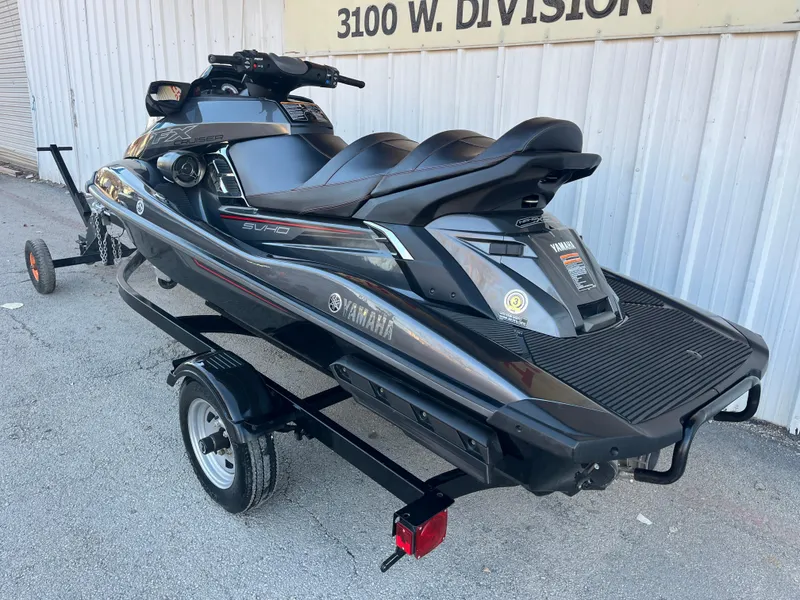Slide: The Image of 2018 Yamaha WaveRunner FX Cruiser SVHO on trailer, parked outdoors. - 14