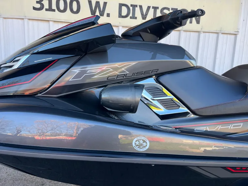 Slide: The Image of 2018 Yamaha WaveRunner FX Cruiser SVHO, sleek design, side view, parked outdoors. - 3