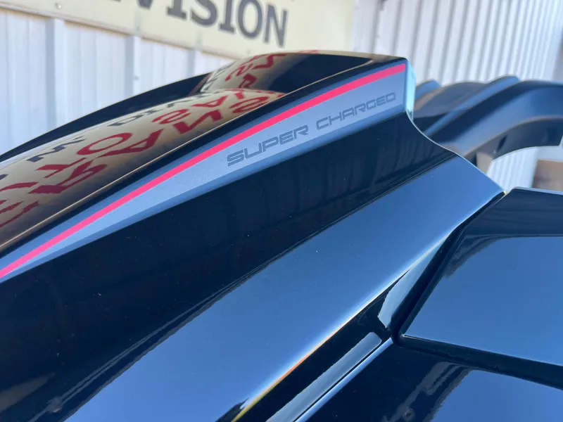 Slide: The Image of 2018 Yamaha WaveRunner FX Cruiser SVHO, supercharged detail, sleek black design. - 4