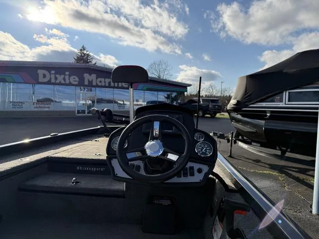 Slide: The Image of 2021 Ranger RT178 boat dashboard at Dixie Marine dealership under a cloudy sky. - 4
