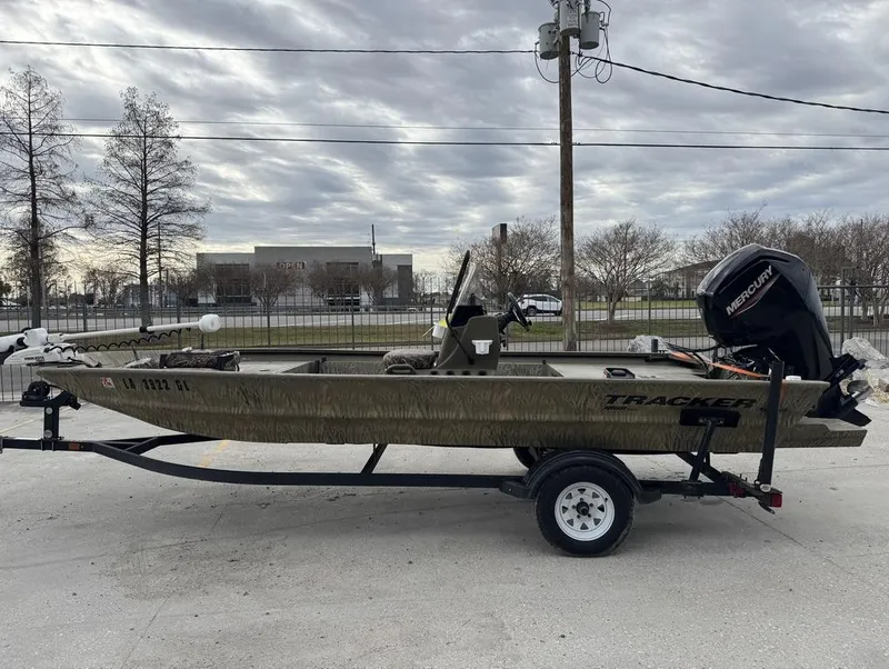 Slide: The Image of 2020 Tracker Grizzly 1860 CC boat on trailer, overcast sky background. - 3