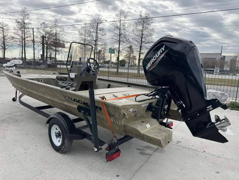 Slide: The Image of 2020 Tracker Grizzly 1860 CC boat with Mercury engine on trailer. - 8