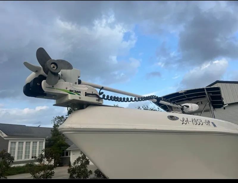 Slide: The Image of 2001 Donzi 32 ZF Open boat with trolling motor, under a cloudy sky. - 13