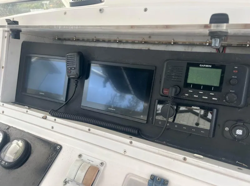 Slide: The Image of Dashboard of a 2001 Donzi 32 ZF Open boat with Garmin electronics. - 25