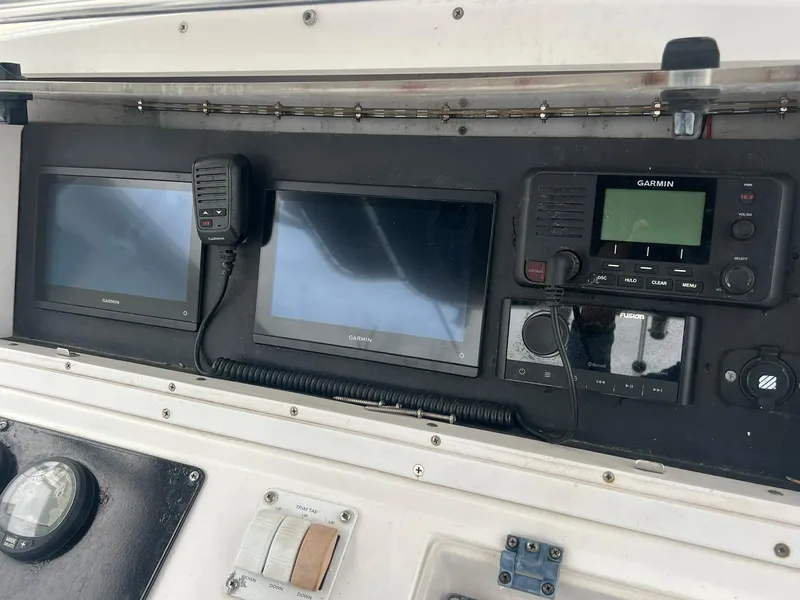 Slide: The Image of Control panel of a 2001 Donzi 32 ZF Open boat with navigation equipment. - 26