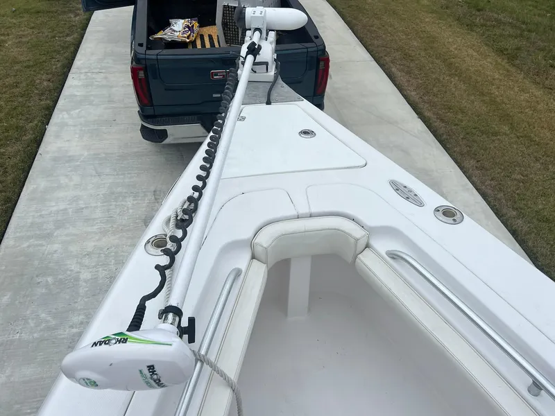 Slide: The Image of 2001 Donzi 32 ZF Open boat with trolling motor, parked near a truck. - 30