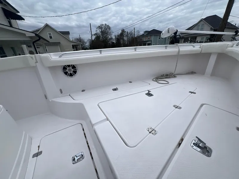 Slide: The Image of 2001 Donzi 32 ZF Open boat deck with storage compartments and speaker. - 32