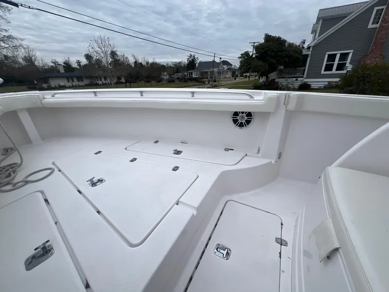 Slide: The Image of 2001 Donzi 32 ZF Open boat interior, featuring spacious deck and storage compartments. - 34