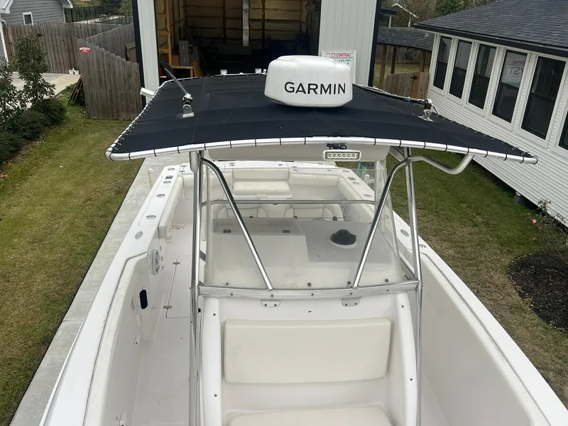 Slide: The Image of 2001 Donzi 32 ZF Open boat with Garmin equipment, docked near a house. - 36