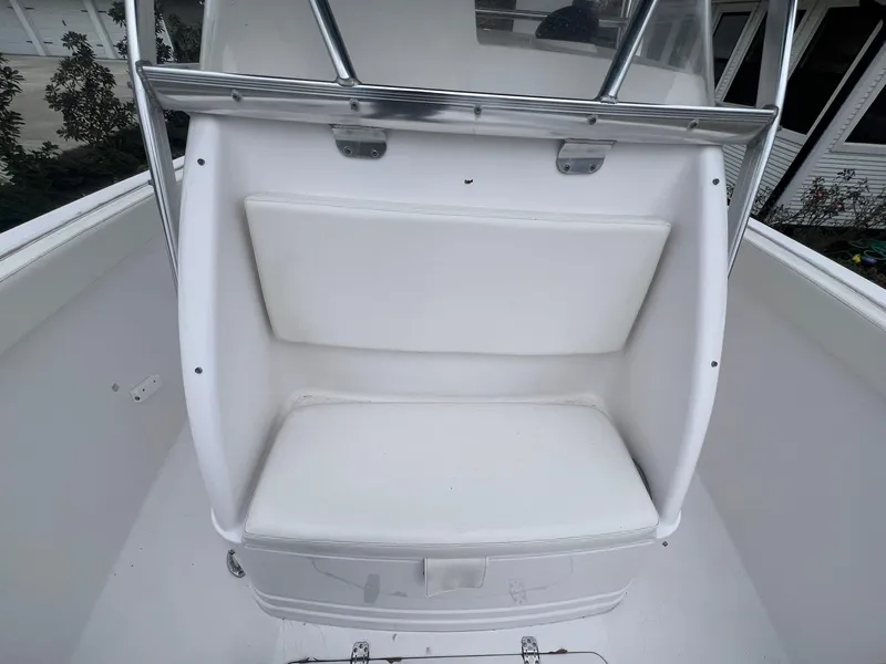 Slide: The Image of 2001 Donzi 32 ZF Open boat with white cushioned seating and stainless steel frame. - 38