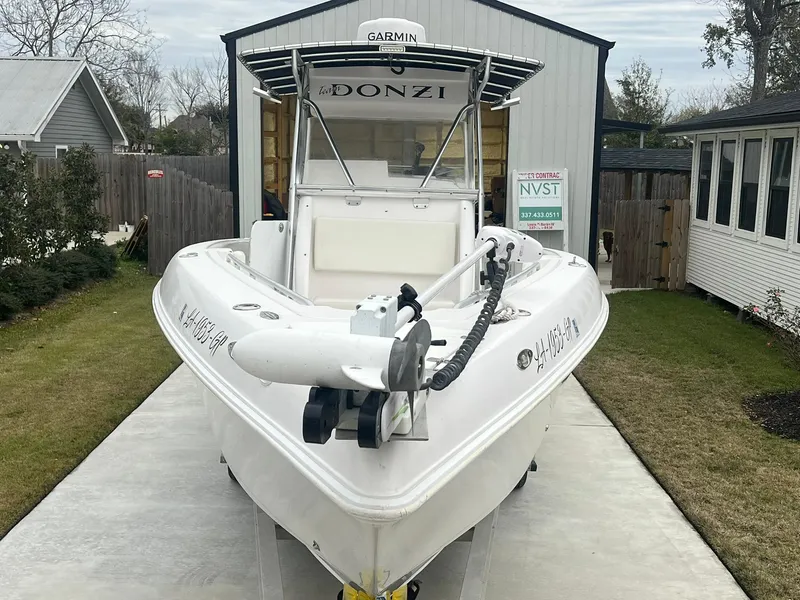 Slide: The Image of 2001 Donzi 32 ZF Open boat parked on a driveway near a garage. - 4