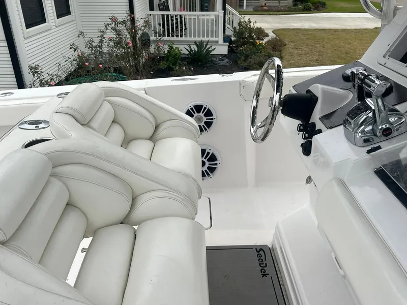 Slide: The Image of 2001 Donzi 32 ZF Open boat interior with white seating and steering console. - 40