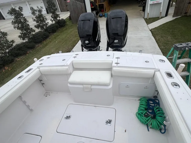 Slide: The Image of 2001 Donzi 32 ZF Open boat deck with twin engines and coiled green rope. - 41