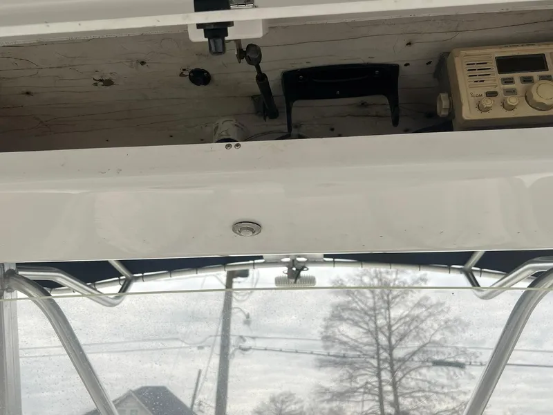 Slide: The Image of 2001 Donzi 32 ZF Open boat console with radio equipment and overhead storage. - 46