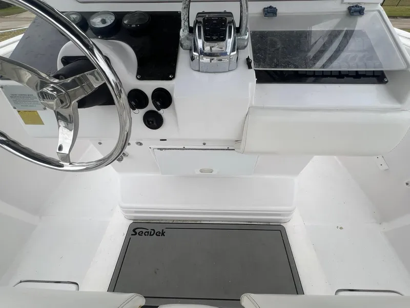Slide: The Image of 2001 Donzi 32 ZF Open boat cockpit with steering wheel and controls. - 47