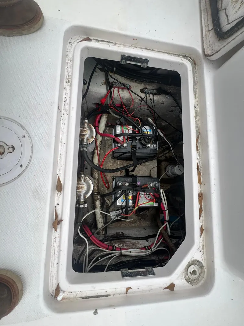 Slide: The Image of 2001 Donzi 32 ZF Open boat battery compartment with wiring and connections. - 48