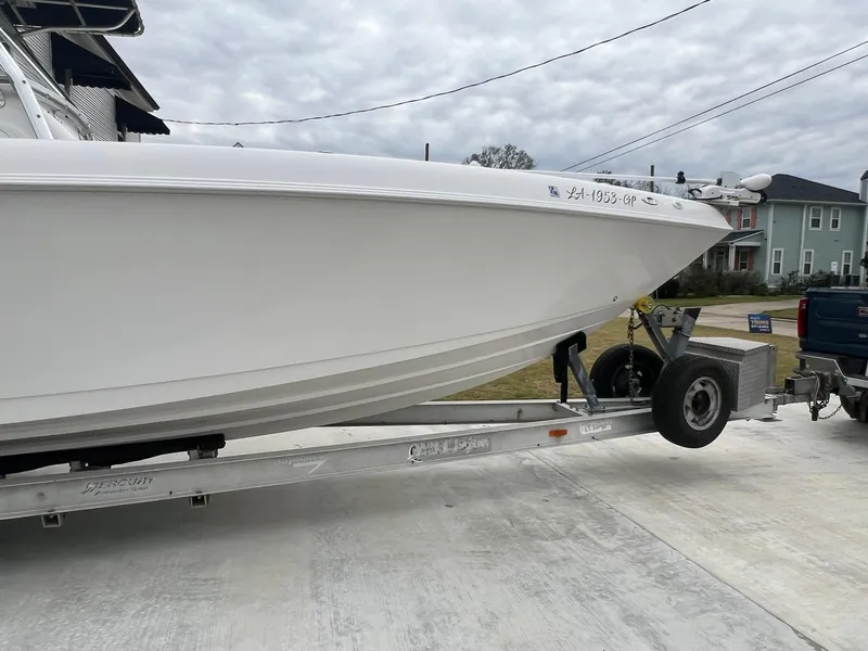 Slide: The Image of 2001 Donzi 32 ZF Open boat on trailer, parked outdoors. - 7