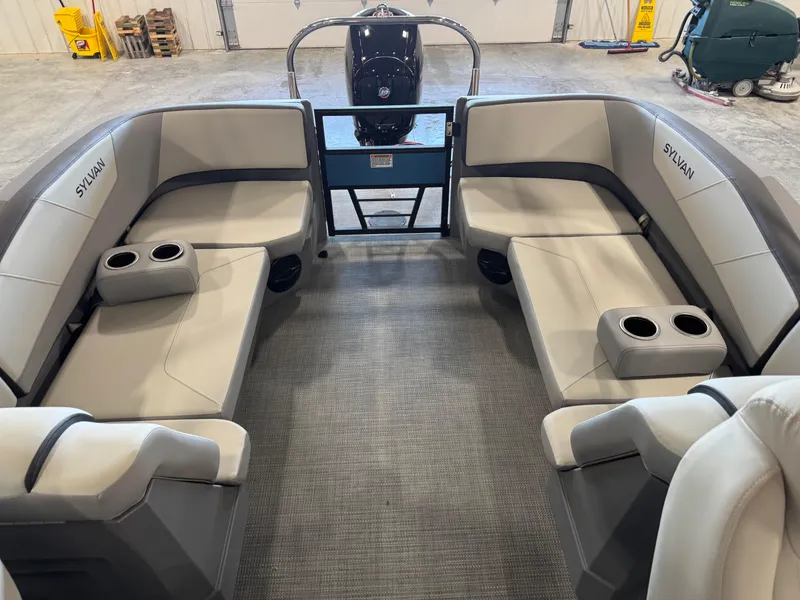Slide: The Image of 2025 Sylvan A-22 Sport boat interior with gray seating and cup holders. - 10