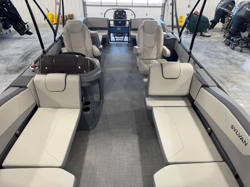 Slide: The Image of 2025 Sylvan A-22 Sport boat interior with beige seating and modern design. - 12