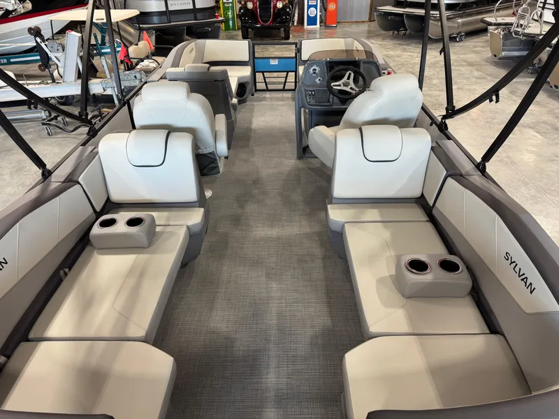 Slide: The Image of 2025 Sylvan A-22 Sport boat interior with seating and steering console. - 7