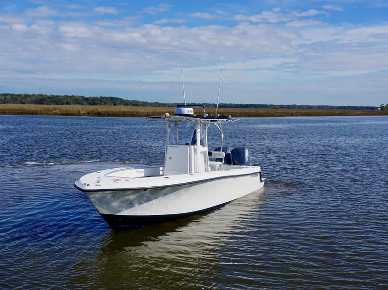 Slide: The Image of 1998 Contender 25 Open boat on calm water under a partly cloudy sky. - 3