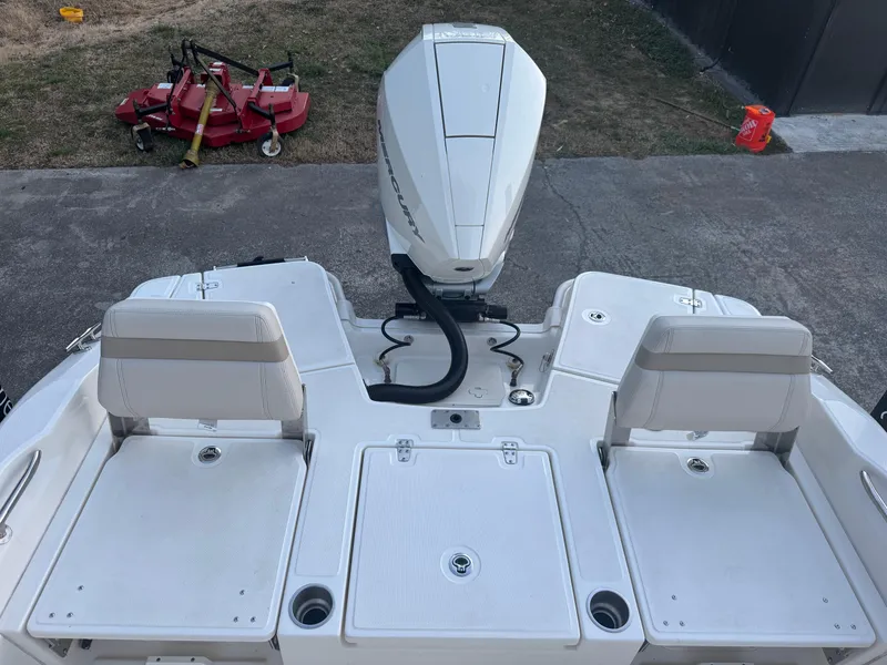 Slide: The Image of 2023 Boston Whaler 250 Dauntless boat stern with outboard motor and seating. - 14