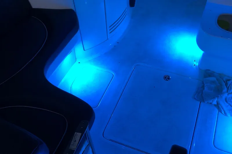 Slide: The Image of 2005 Cobalt 360 interior with blue LED lighting, highlighting seating and floor details. - 10