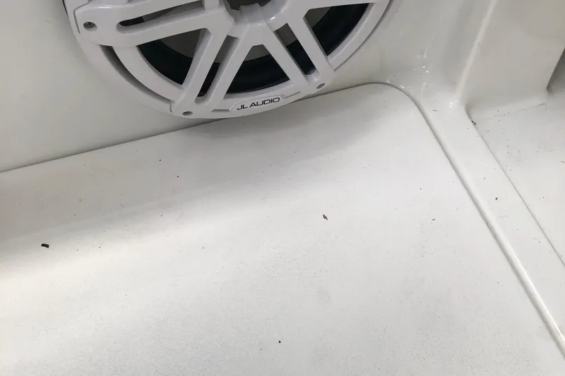 Slide: The Image of White JL Audio speaker on a 2005 Cobalt 360 boat interior. - 14