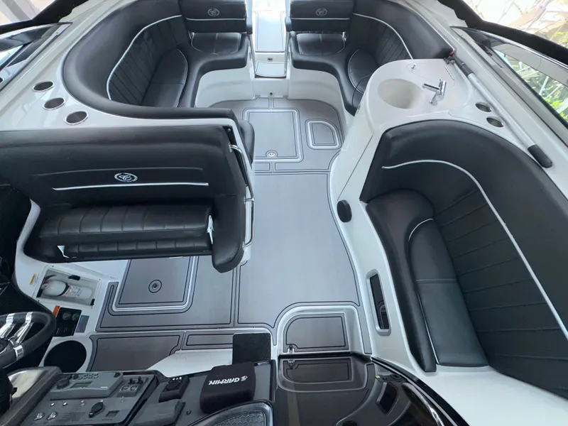 Slide: The Image of Luxurious interior of a 2005 Cobalt 360 boat with sleek black seating and modern design. - 4