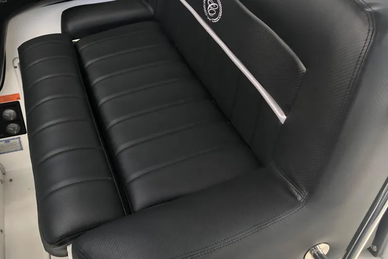 Slide: The Image of Black leather seating on a 2005 Cobalt 360 boat, featuring sleek design and stitching. - 9