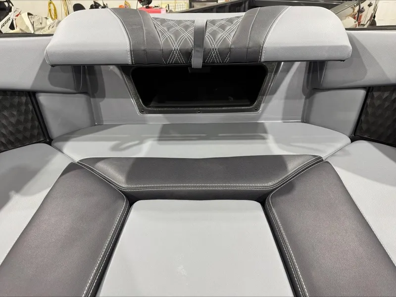 Slide: The Image of 2024 Malibu M242 boat interior with sleek, modern seating design. - 20