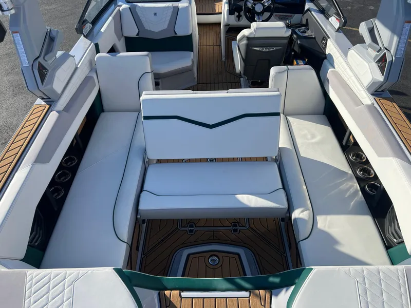Slide: The Image of 2024 Nautique G25 boat interior with luxurious seating and modern design. - 14