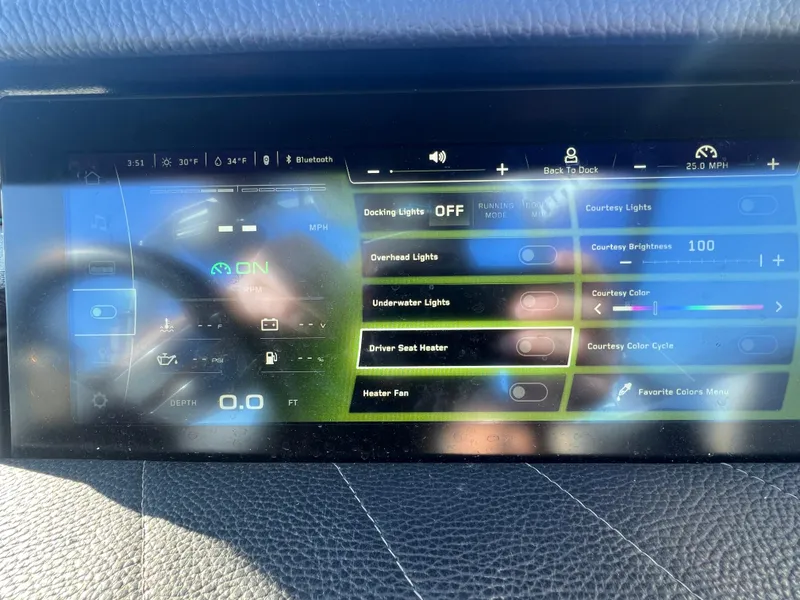 Slide: The Image of 2024 Nautique G25 touchscreen display showing lighting and heating controls. - 20