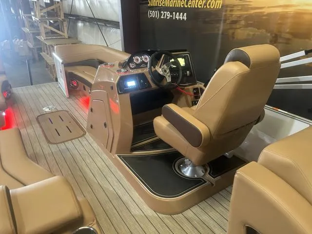Slide: The Image of 2025 SunCatcher Fusion Series 324SS boat interior with Yamaha 250 "SHO" engine, featuring tan seating. - 13