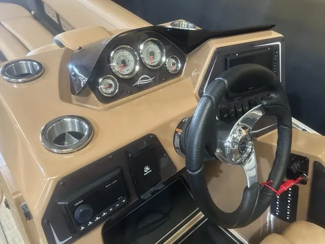 Slide: The Image of 2025 SunCatcher Fusion Series 324SS dashboard with steering wheel and gauges. - 18