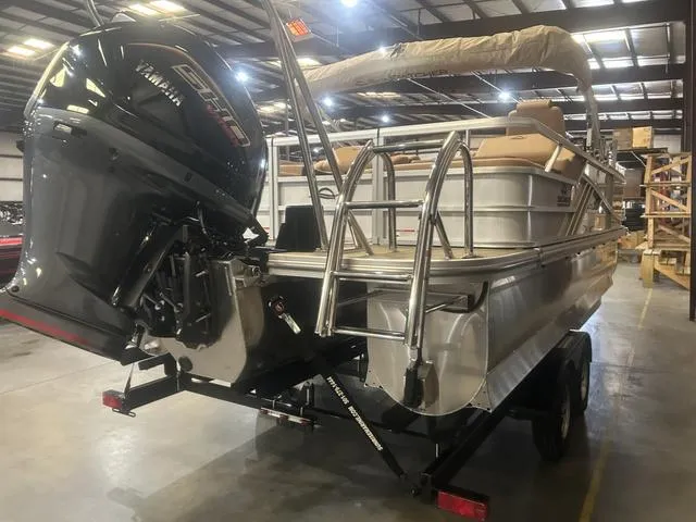 Slide: The Image of 2025 SunCatcher Fusion Series 324SS pontoon boat with Yamaha 250 "SHO" engine in a warehouse. - 4