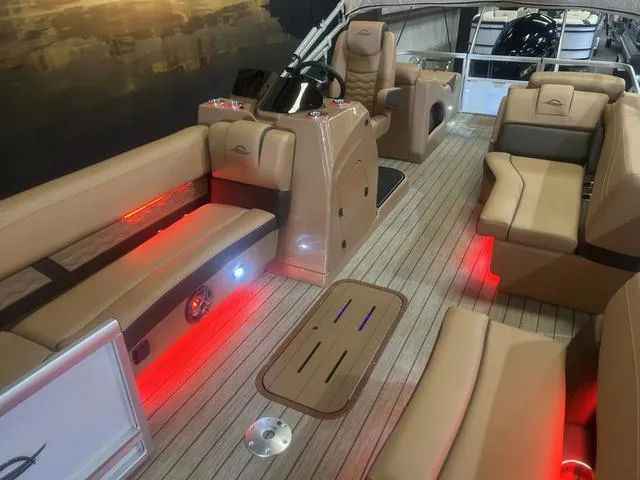 Slide: The Image of 2025 SunCatcher Fusion Series 324SS boat interior with Yamaha 250 "SHO", featuring ambient lighting. - 8