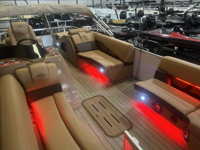 Slide: The Image of Luxurious 2025 SunCatcher Fusion Series 324SS boat interior with ambient red lighting. - 9