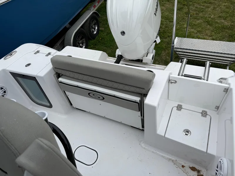 Slide: The Image of 2025 Sportsman Open 212 Center Console boat interior with seating and storage compartments. - 10